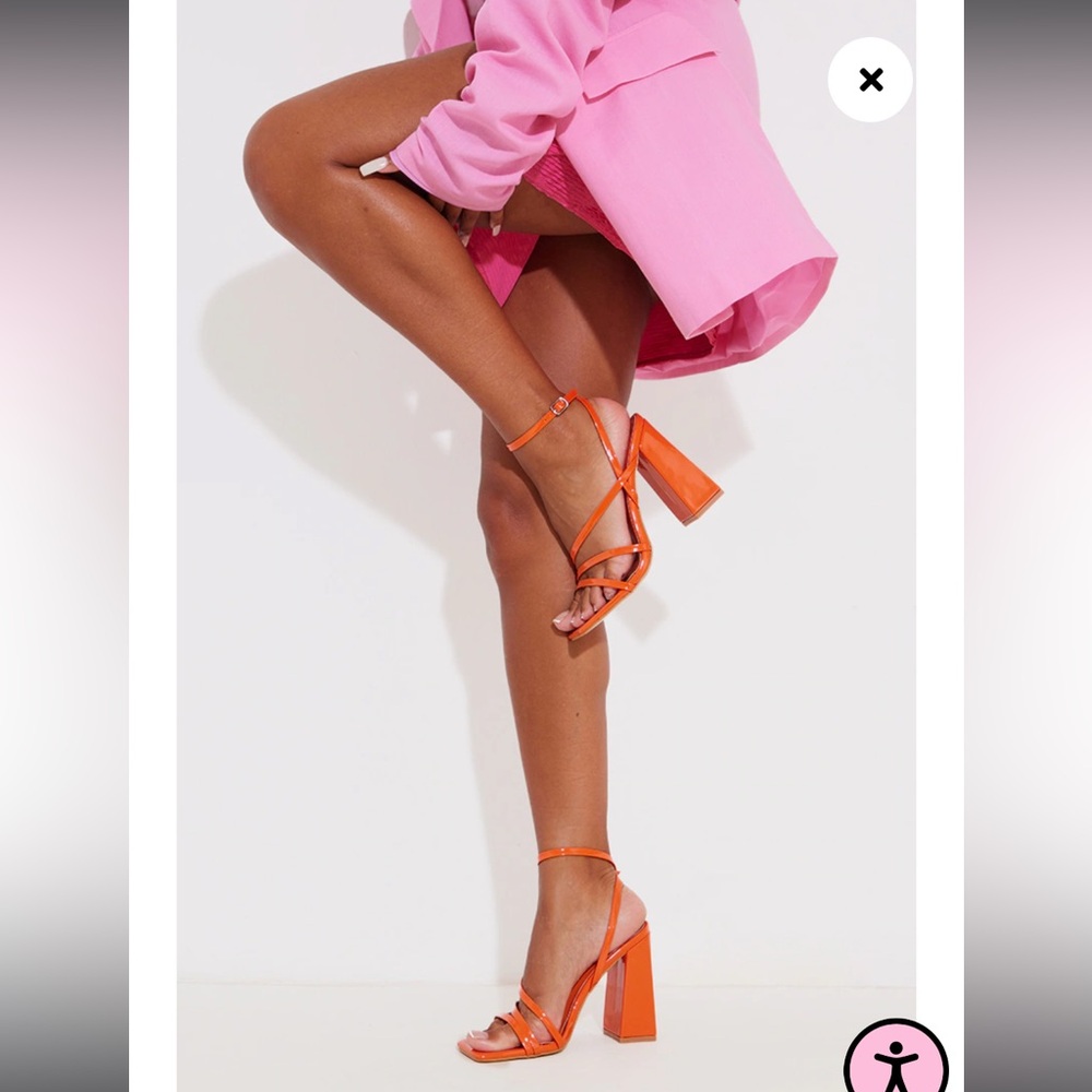 Orange block heeled sandals.